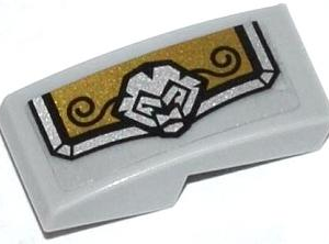 11477pb003L - Slope, Curved 2 x 1 x 2/3 with Gold and Silver Armor Plate with Lion Head and Black Swirls Pattern Model Left Side (Sticker) - Set 70123