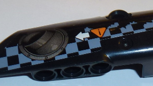 64391pb033 - Technic, Panel Fairing # 4 Small Smooth Long, Side B with Exhaust Port, White Arrow, Orange Caution Sign, Gray Checkered Pattern (Sticker) - Set 42002