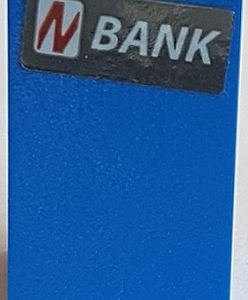 3684cpb023 - Slope 75 2 x 2 x 3 - Solid Studs with Slanted Red Letter N in White Rounded Rectangle and White 'BANK' Pattern (Sticker) - Set 76082